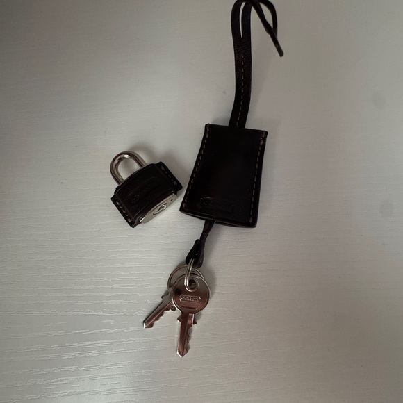 Coach lock and key in maple color